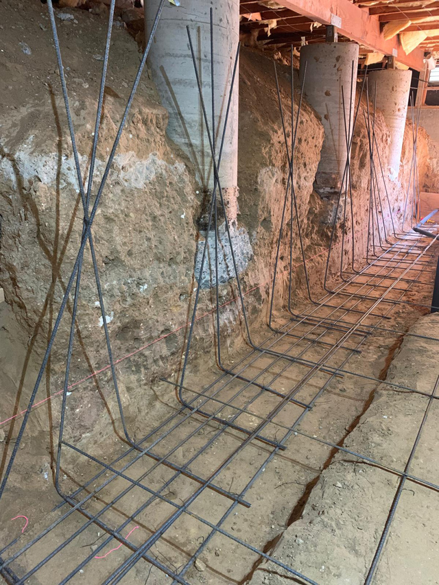 Reinforced cement foundation laid for strong, durable building support.