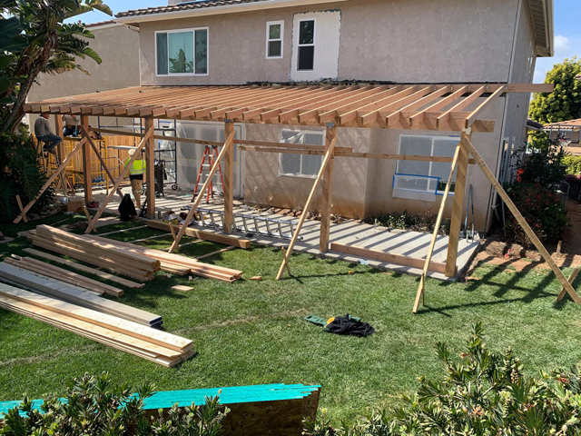 Framed building for patio deck and roof, providing solid structure and support.